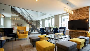 Group accommodation at the Koppenberg with Sauna and Tree House | Living area | Flat-screen TV