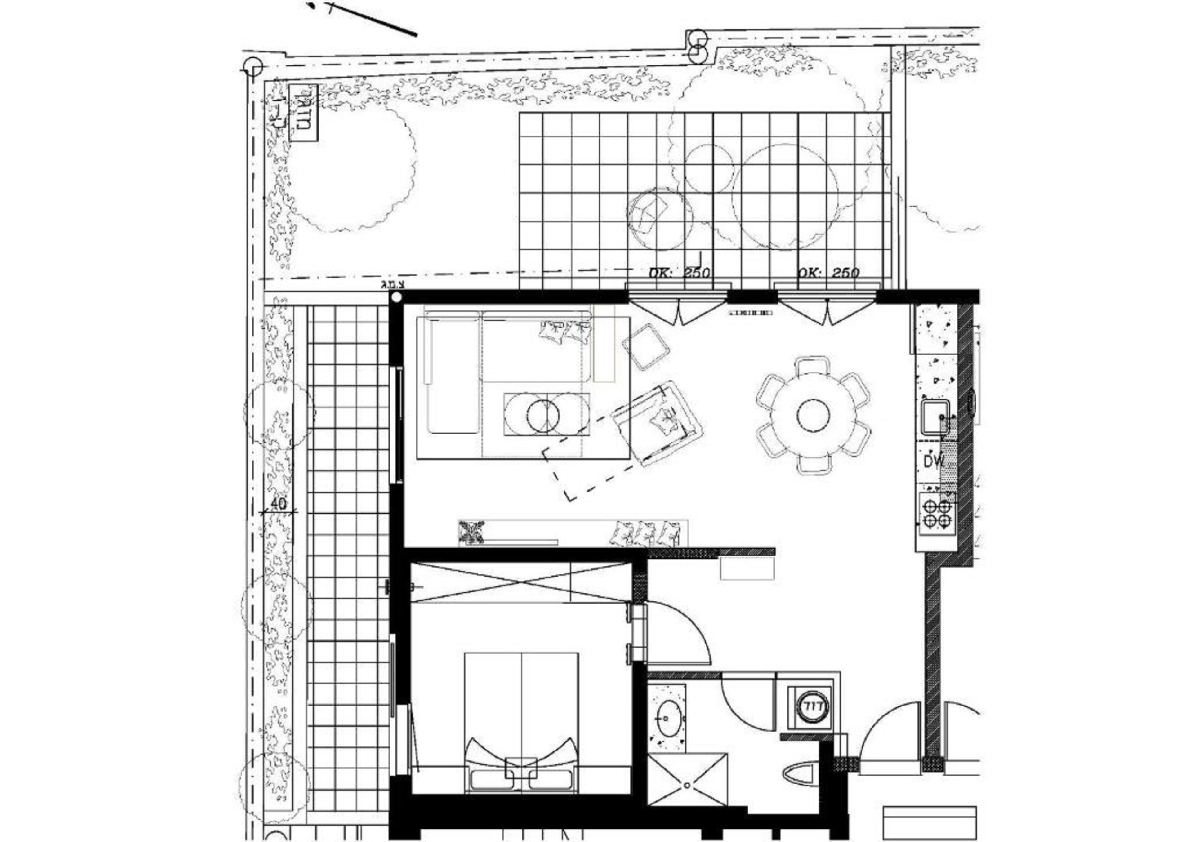 A floor plan of a hotel room with a bed, a desk, a chair, a small bathroom, and a dining area with a table and chairs.