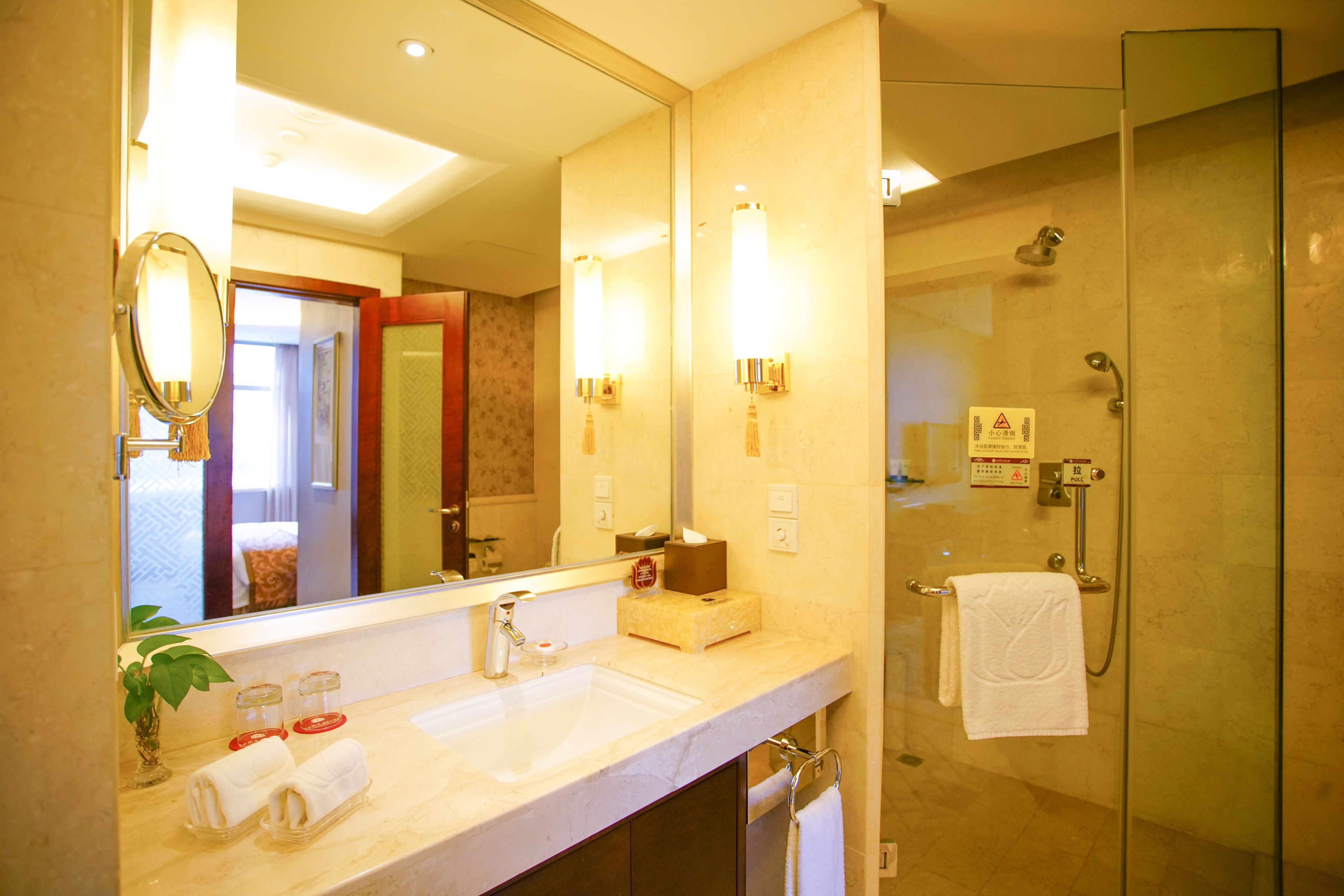 deluxe suite | bathroom | shower, free toiletries, hair dryer, slippers