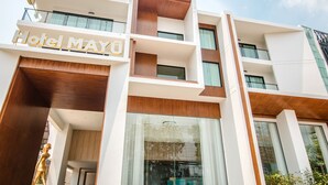 A modern hotel building with the name "Hotel MAYU" prominently displayed. It features multiple balconies and large windows. - Hotel MAYU Chiang Mai (Chiang Mai)