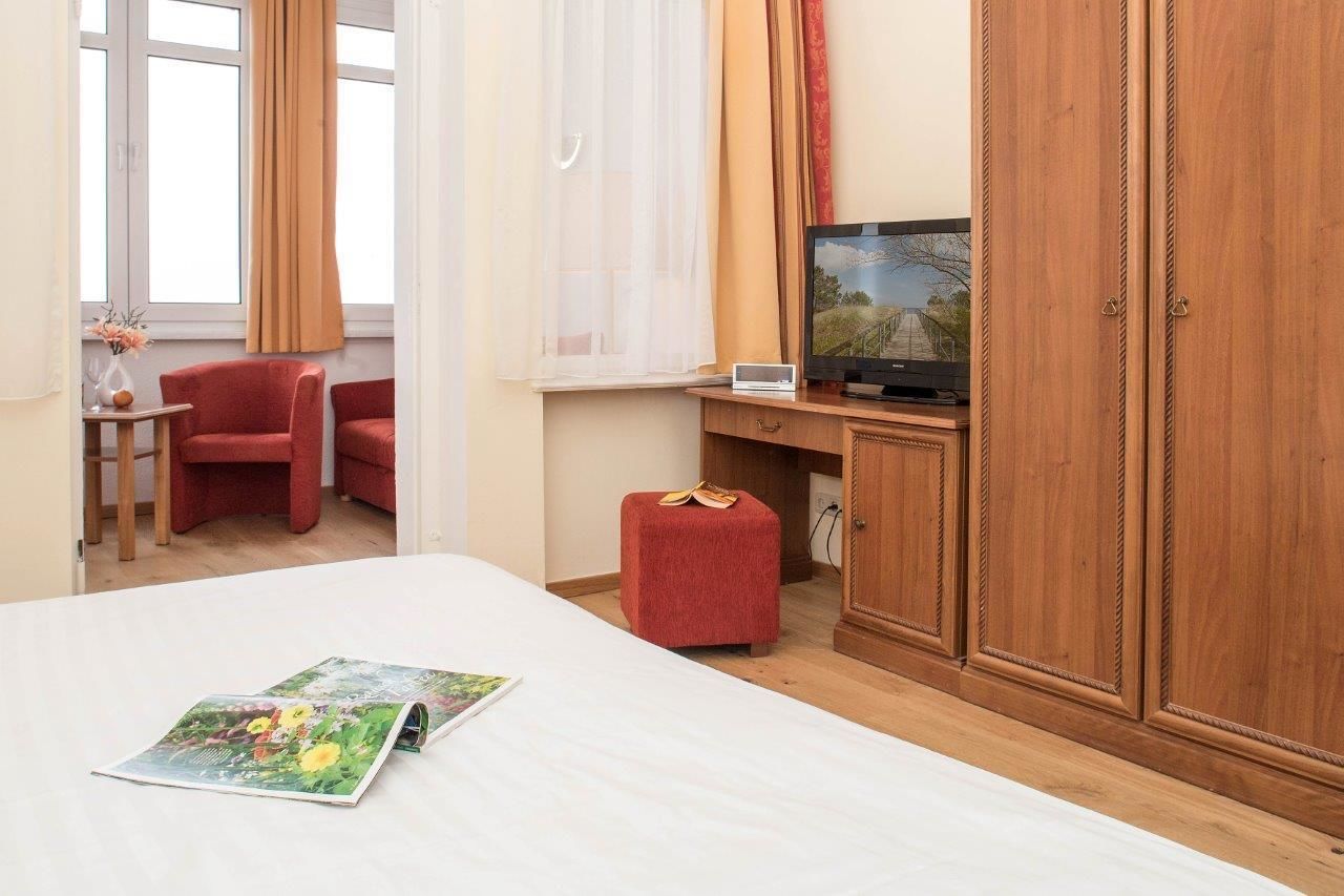 double room, patio, ocean view | living area | flat-screen tv