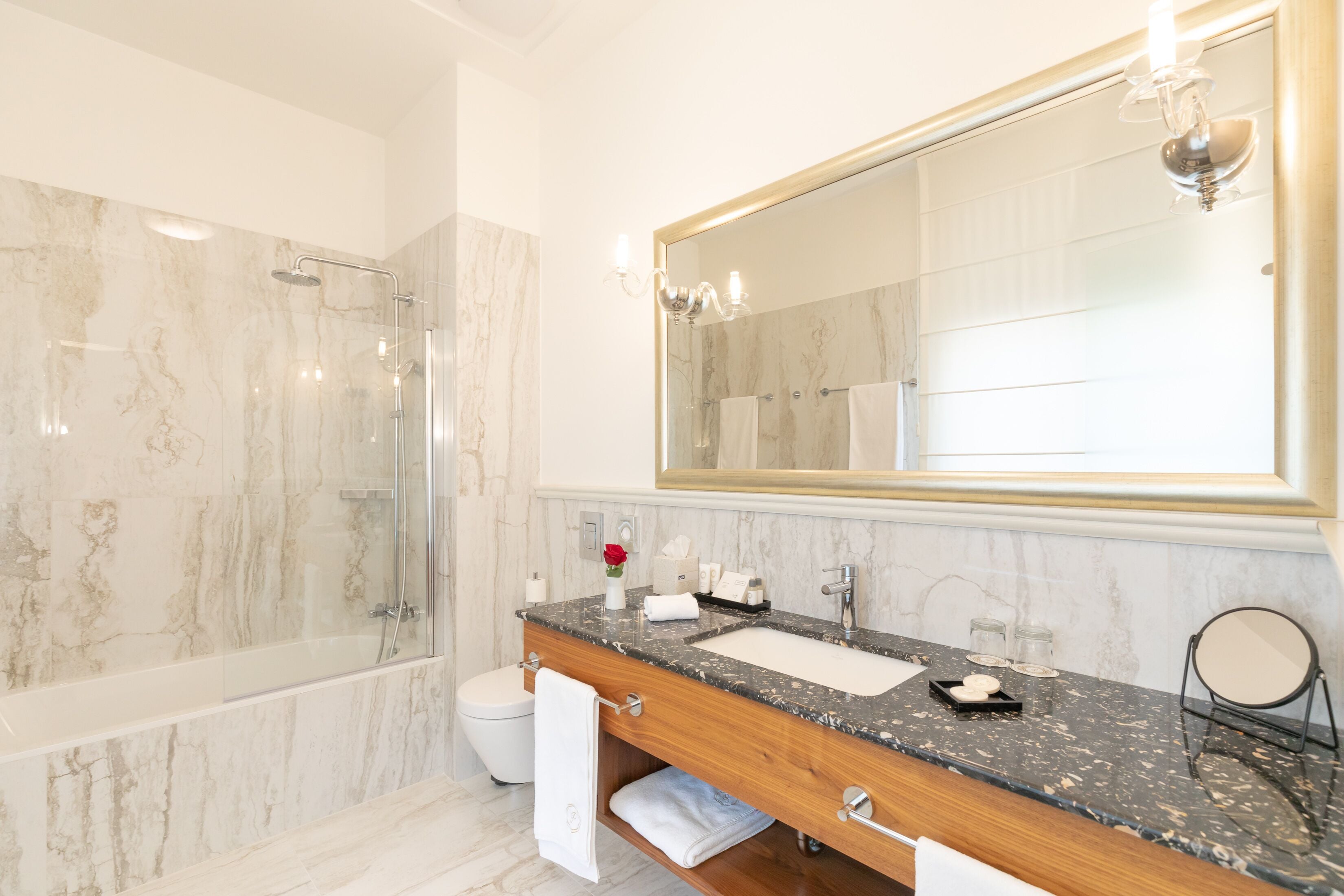 deluxe double or twin room | bathroom | rainfall showerhead, designer toiletries, hair dryer, bathrobes