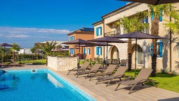 Seasonal outdoor pool, open 8:00 AM to 8:00 PM, pool umbrellas