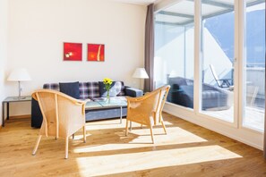 Deluxe Apartment, Balcony, Mountain View | Living area | 32-inch flat-screen TV with cable channels, TV, ping pong - Hapimag Resort Interlaken (Interlaken)