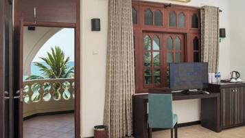 Deluxe Double or Twin Room | Living area | Flat-screen TV