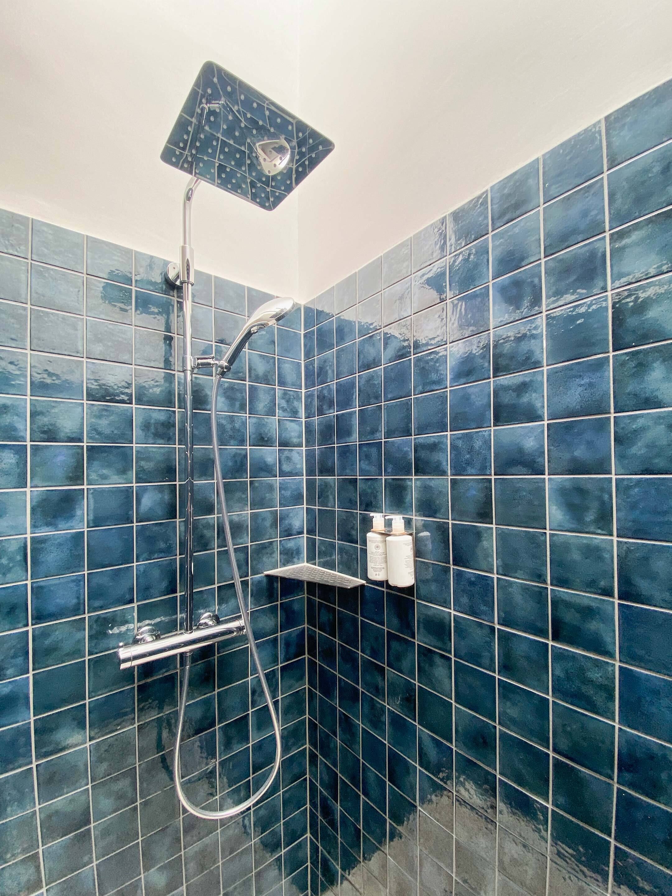 rainfall showerhead, eco-friendly toiletries, hair dryer, towels