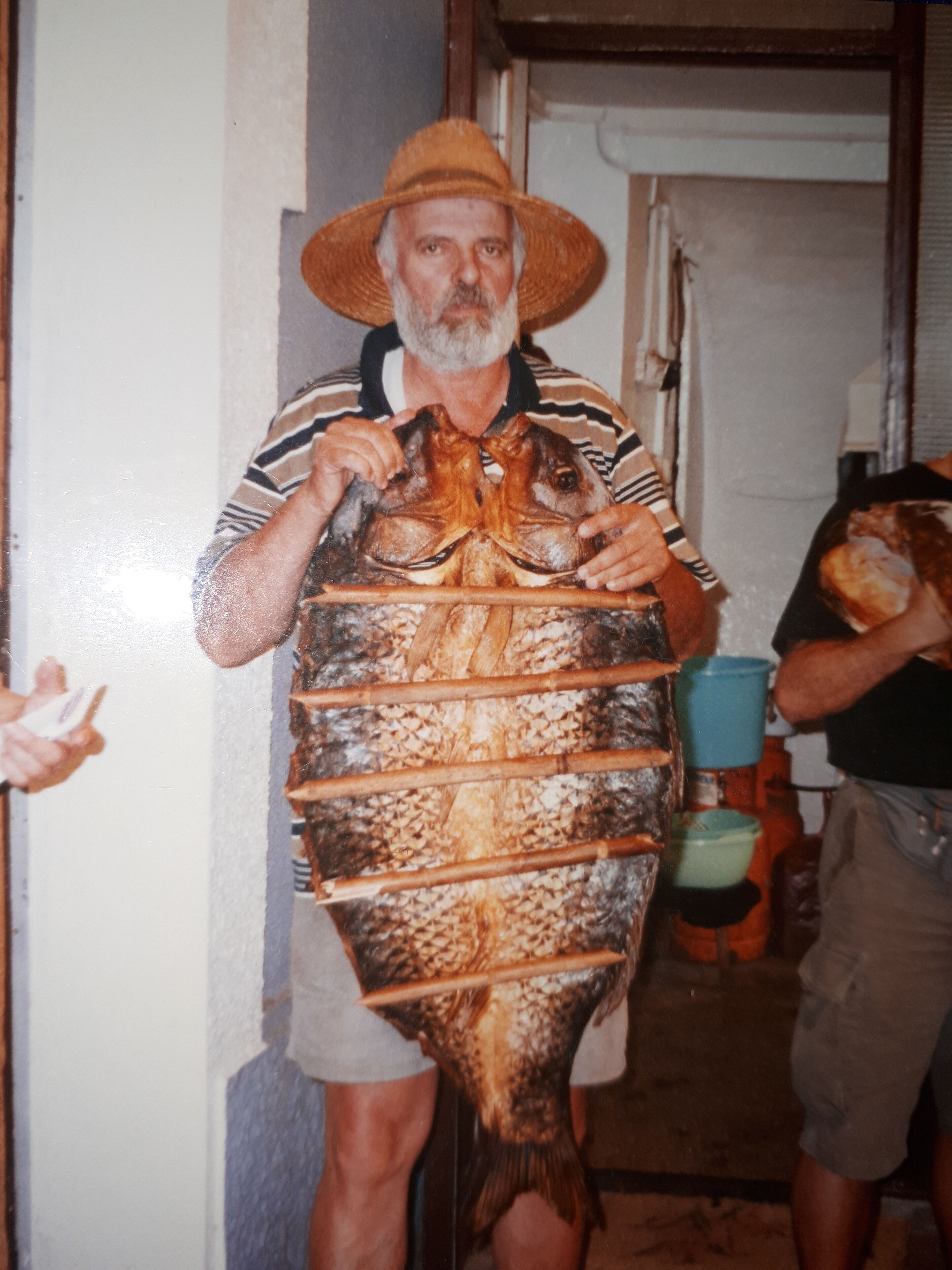 A person holding a large fish.