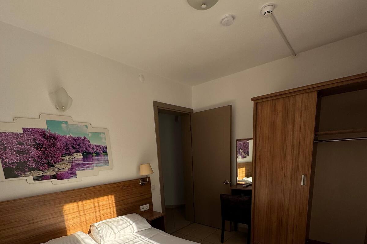 Quadruple Room, River View | Desk, laptop workspace, WiFi (free), bed sheets