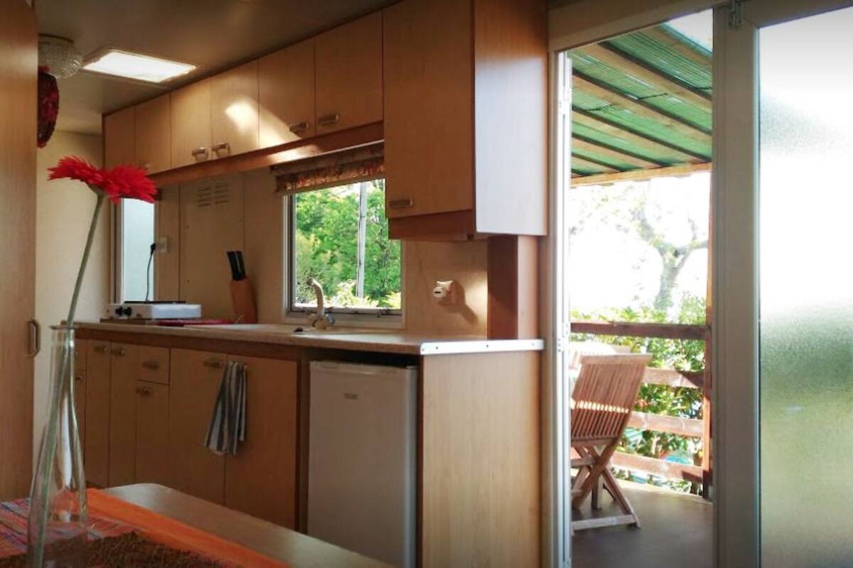 Classic Mobile Home | Private kitchenette | Full-size fridge, oven, stovetop, cookware/dishes/utensils