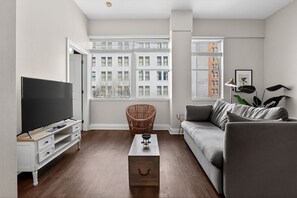 Standard Apartment, 1 Bedroom | Living area | 36-inch flat-screen TV with digital channels, TV - Roami at Duncan Plaza (New Orleans)