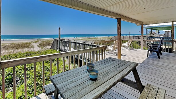 A wooden deck with a view of the beach and ocean. - Kirk's Mema's Beach | Pet Friendly + Walk to Beach (Topsail Beach)