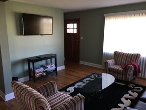 Living Room with 49" Smart HDTV and Dish Network.