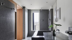 A modern bathroom with a large window, a shower, and a sink area. - Kimpton Da an Taipei by IHG (Taipei)
