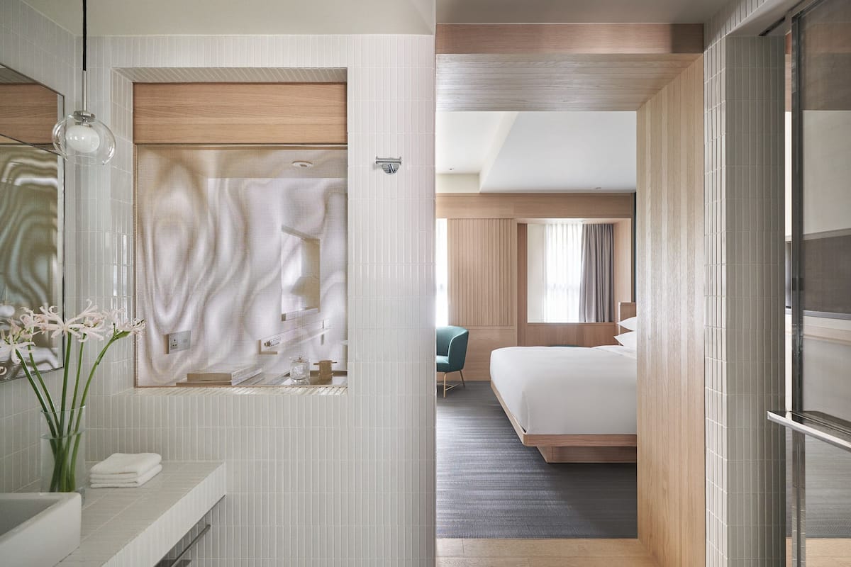 designer toiletries, hair dryer, bathrobes, slippers