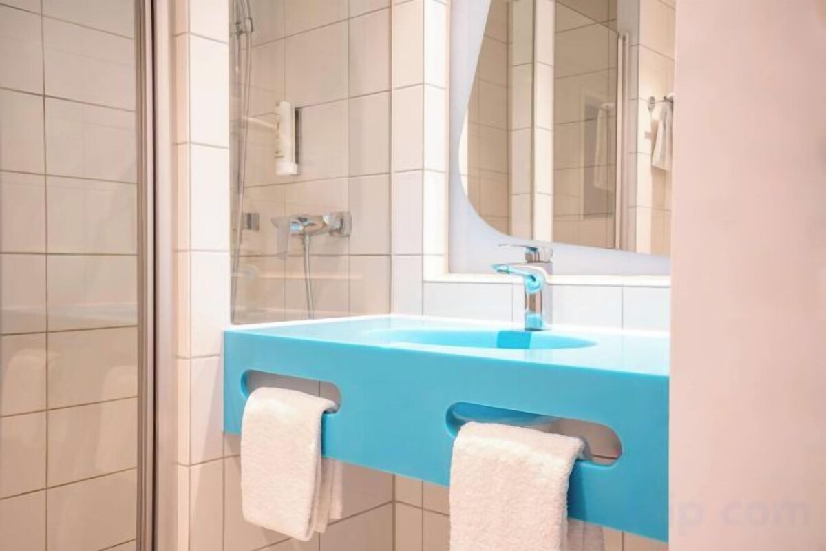 Een douche, een regendouche, een haardroger, vloerverwarming