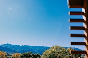 A mountain range in the distance with a clear sky. - SCP WildFree Colorado Springs, Trademark by Wyndham (Colorado Springs)