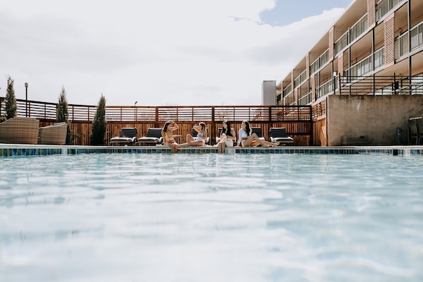 Seasonal outdoor pool, open 11:00 AM to 10:00 PM, sun loungers