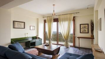 Family Villa, 2 Bedrooms (Villa Foivos) | Living area | Fireplace