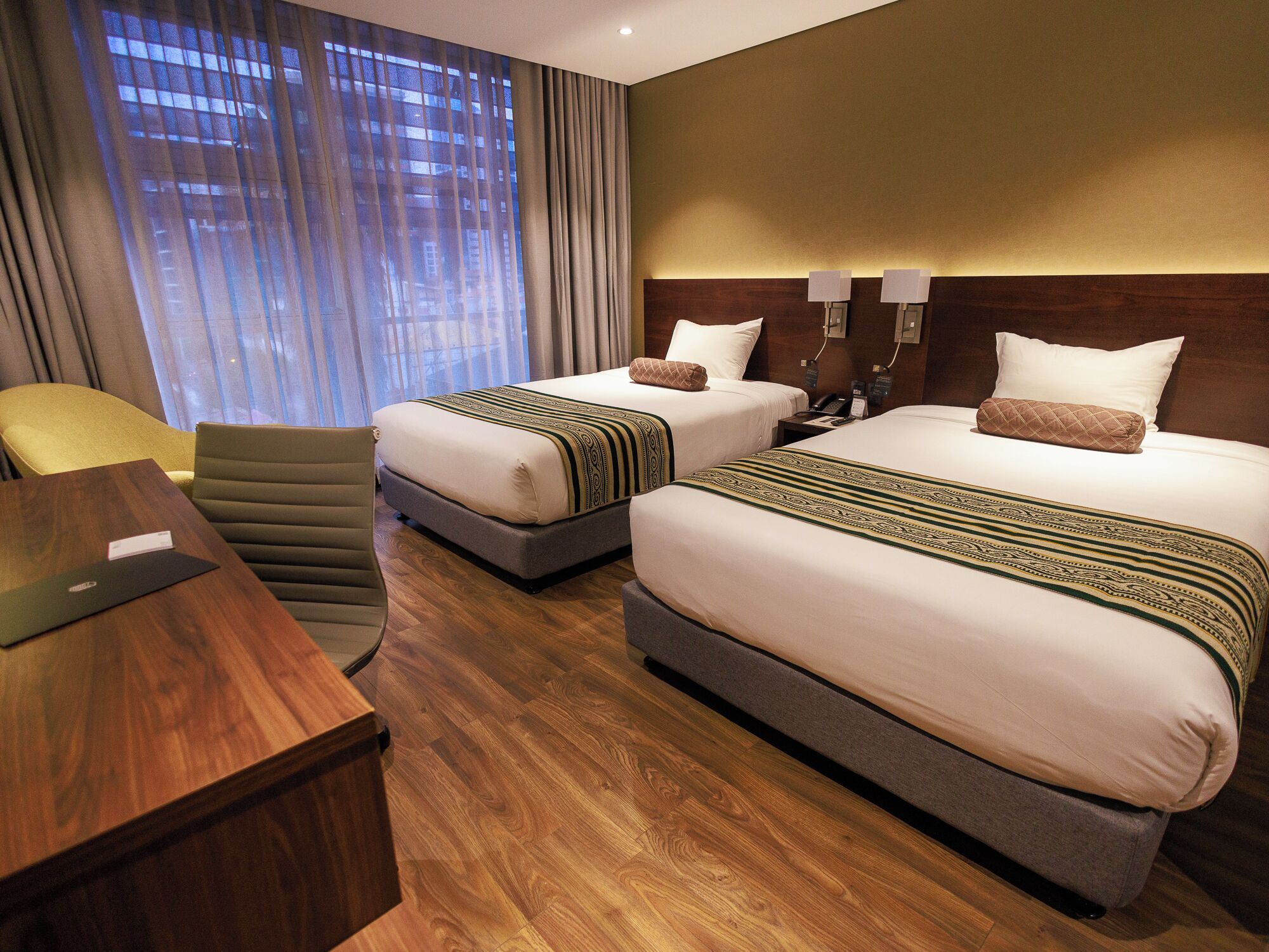 Twin Room | Minibar, in-room safe, desk, iron/ironing board