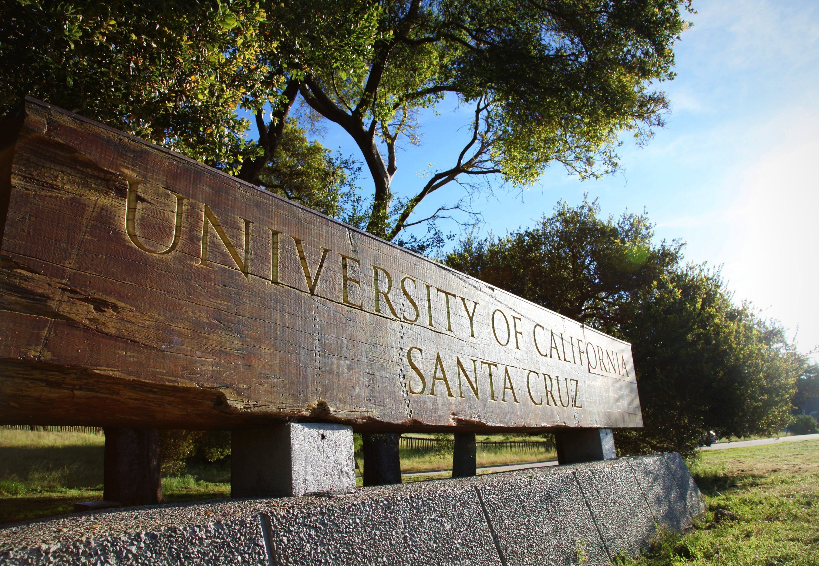 A wooden sign with the text "University of California Santa Cruz".