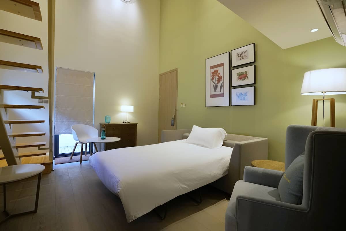 Duplex family room | Minibar, in-room safe, desk, blackout drapes