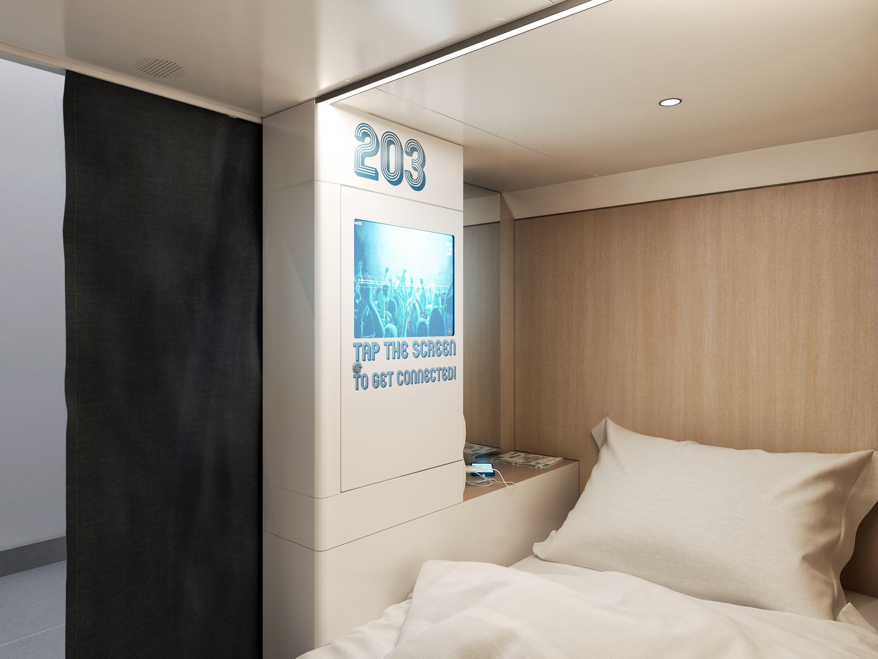 A modern hotel room with a bed, a nightstand, and a wall-mounted screen displaying the number 203 and a message to tap the screen to get connected.
