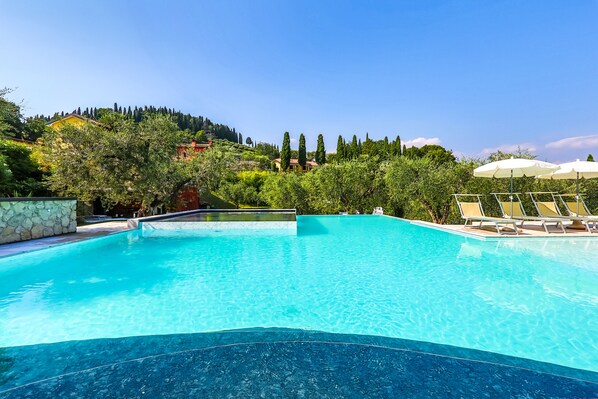 2 outdoor pools, pool umbrellas, pool loungers