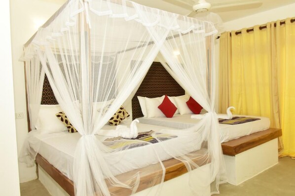 ห้องแฟมิลี่สวีท, วิวสวน | ผ้าปูที่นอนฝ้ายอียิปต์, เครื่องนอนระดับพรีเมียม