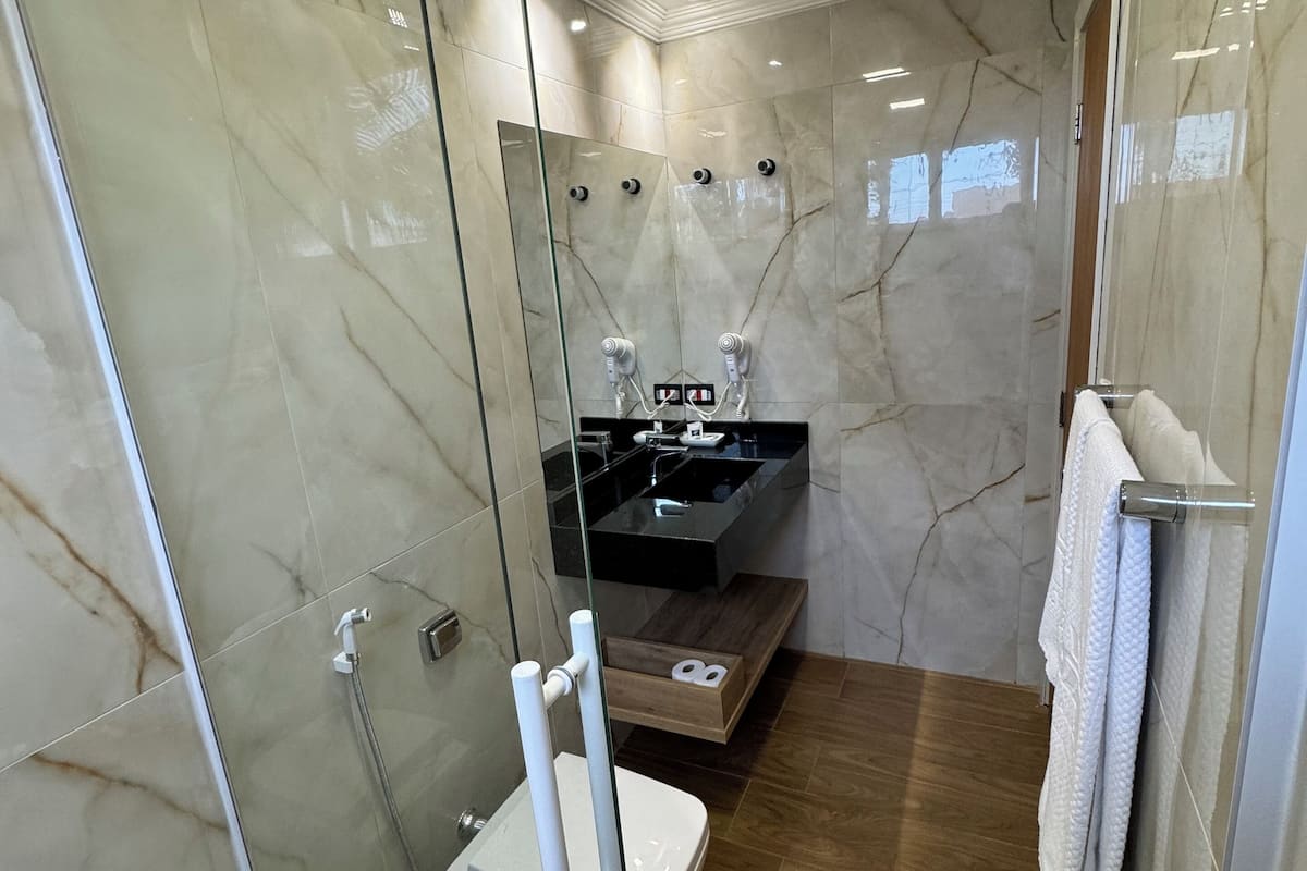 luxury triple room | bathroom | shower, free toiletries, hair dryer, towels