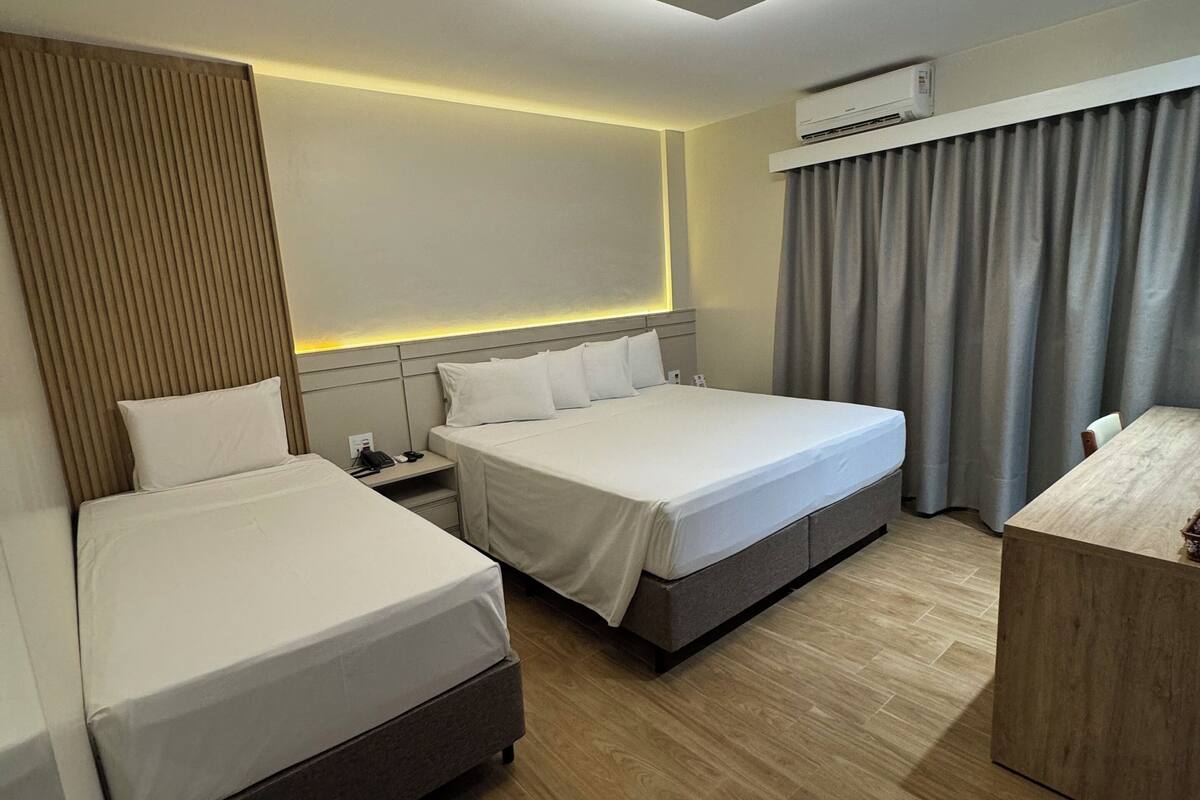 luxury triple room | 1 bedroom, minibar, desk, blackout curtains