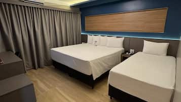 Luxury Triple Room | Minibar, desk, blackout curtains, iron/ironing board