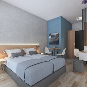 Een moderne hotelkamer met een groot bed, twee nachtkastjes, een bureau en een stoel.