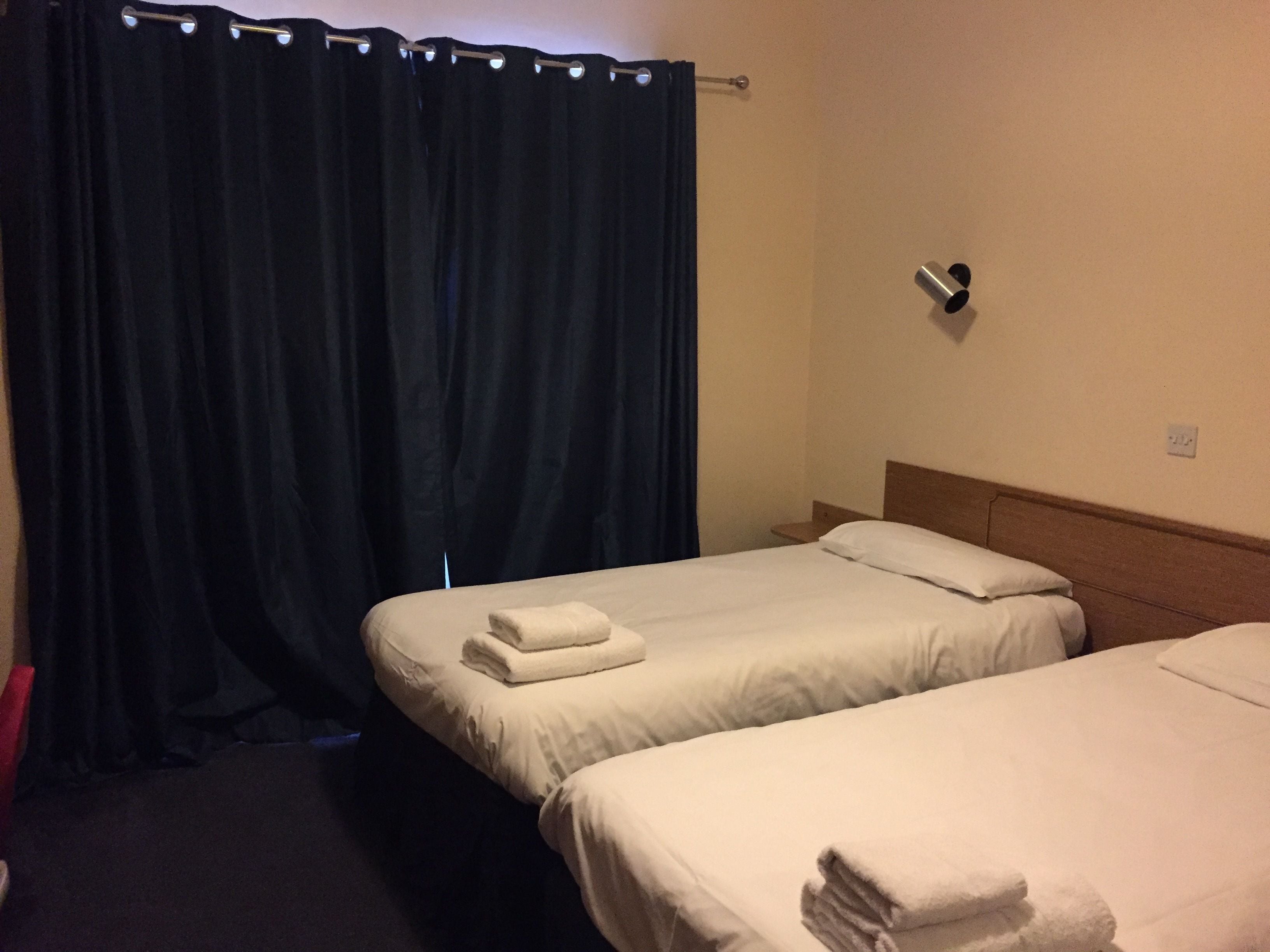 blackout curtains, iron/ironing board, free wifi, bed sheets
