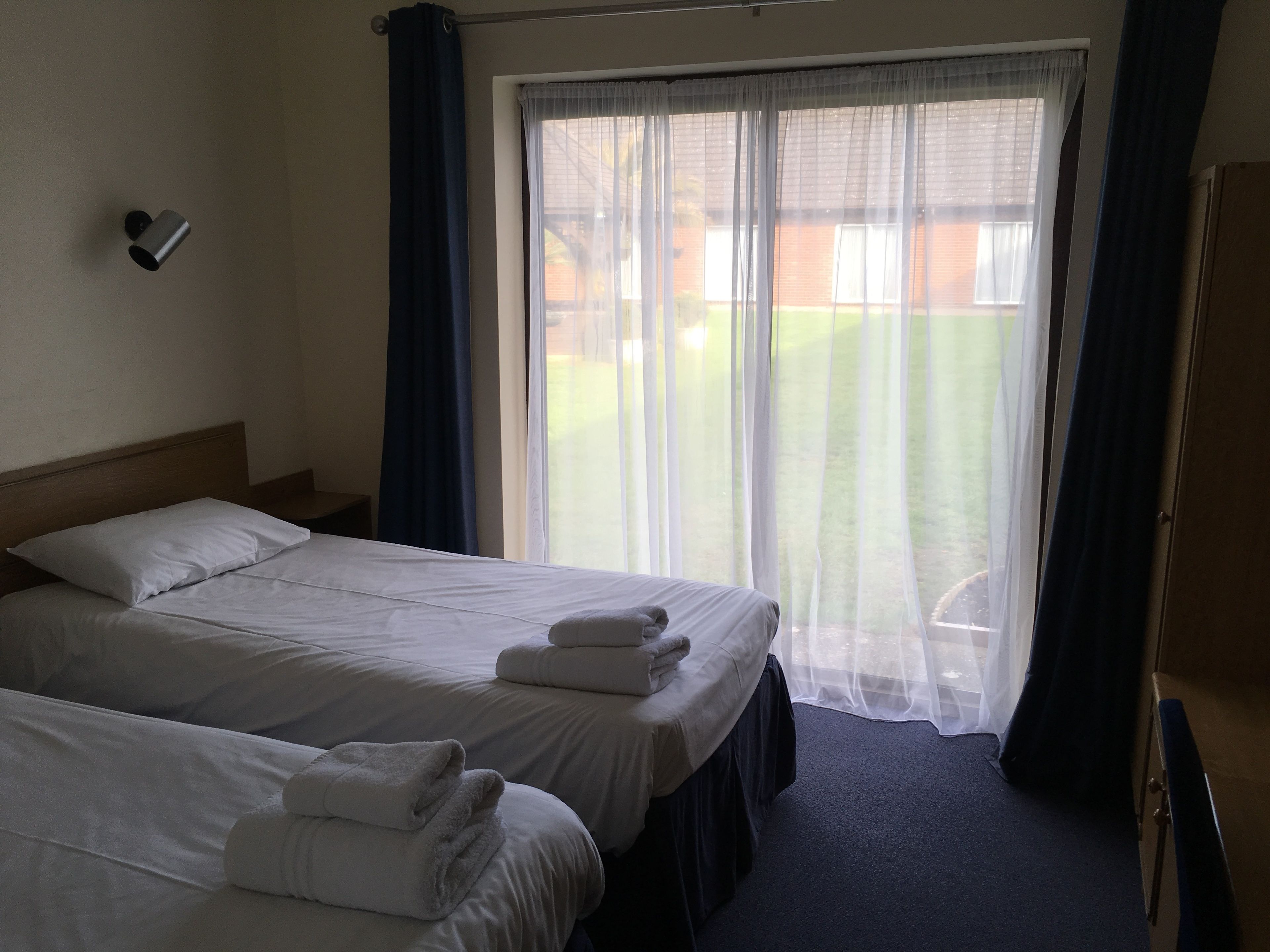 budget twin room | blackout curtains, iron/ironing board, free wifi, bed sheets