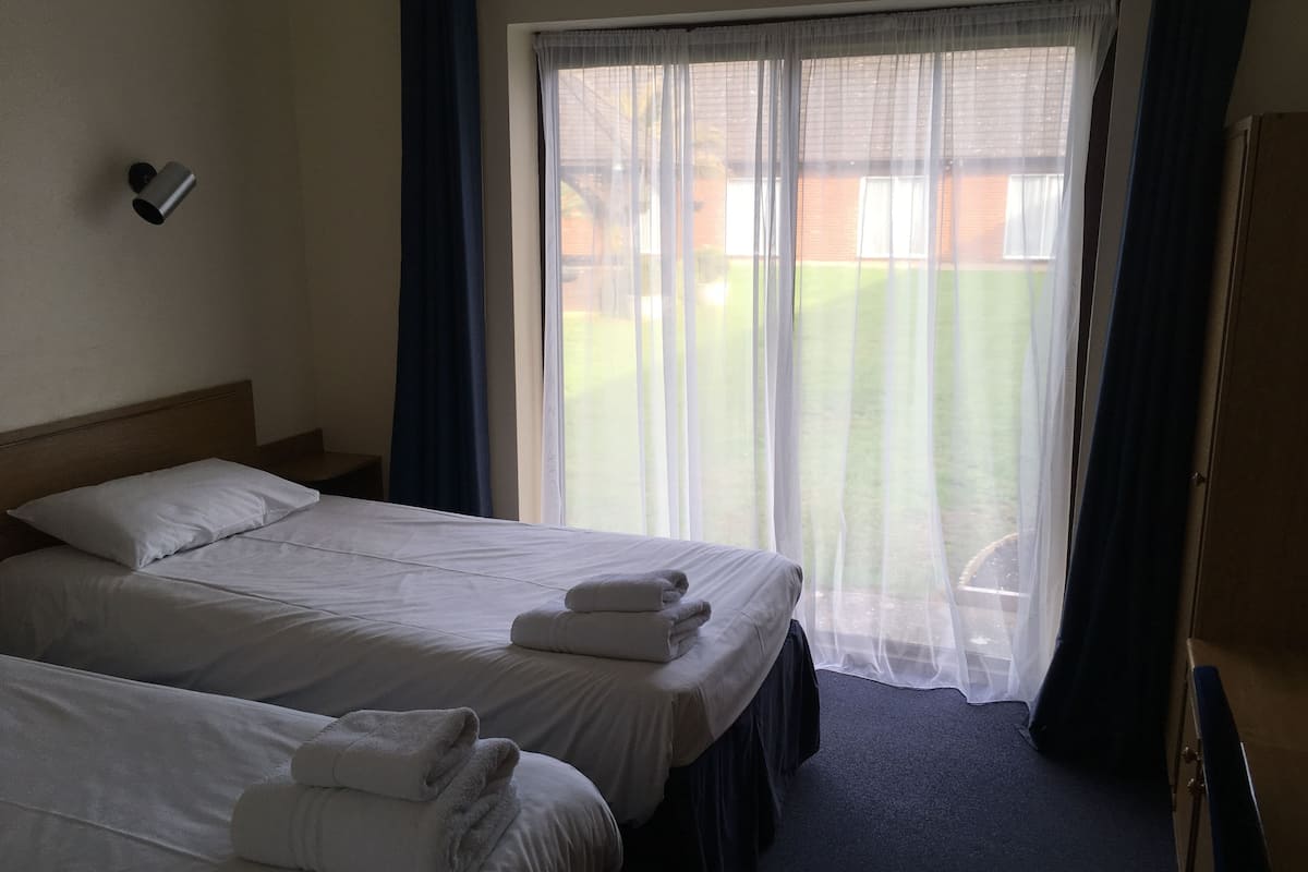 budget twin room | blackout curtains, iron/ironing board, free wifi, bed sheets