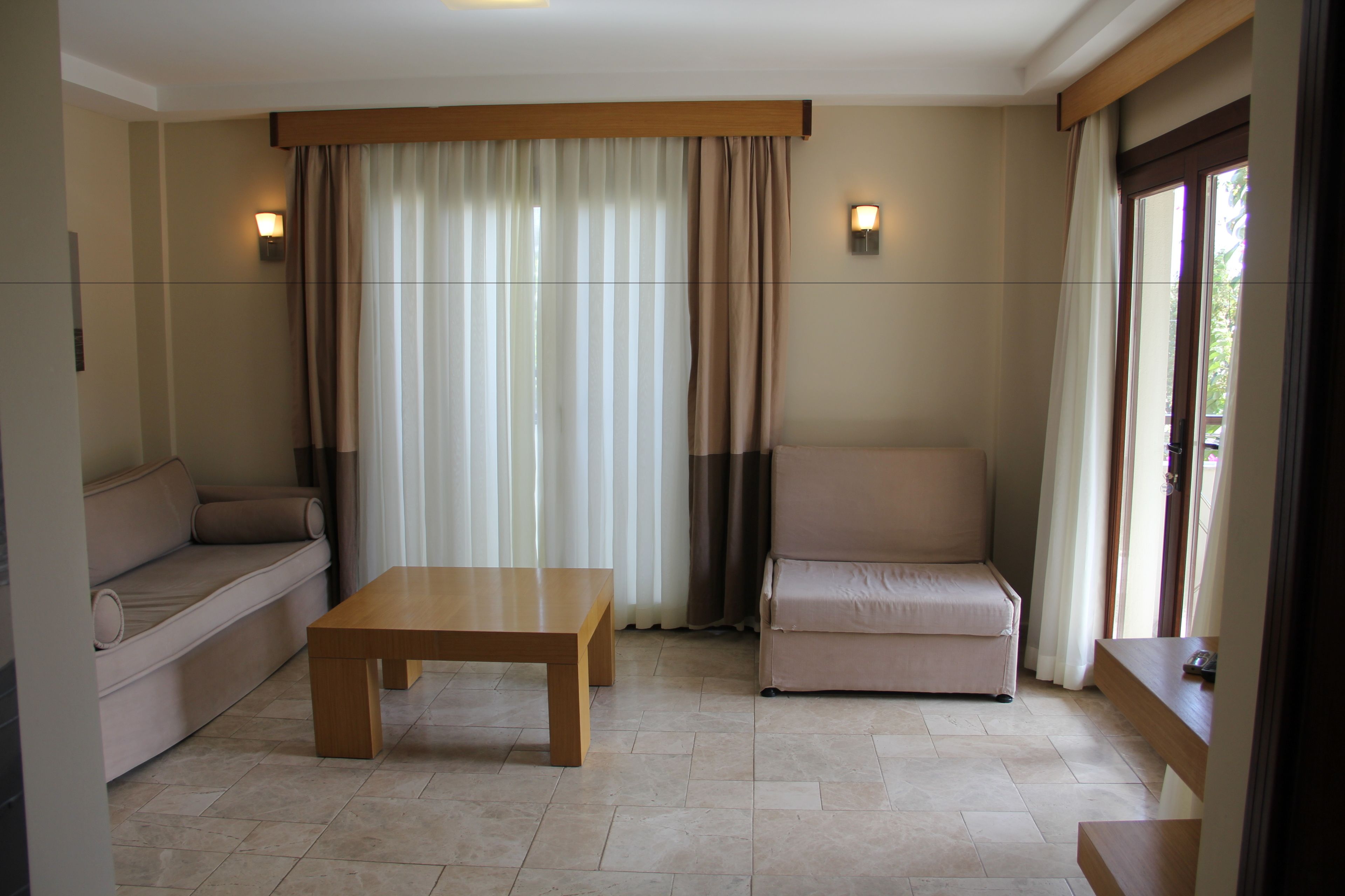 Apartamento, 1 habitación | Zona de estar | Una televisión LCD