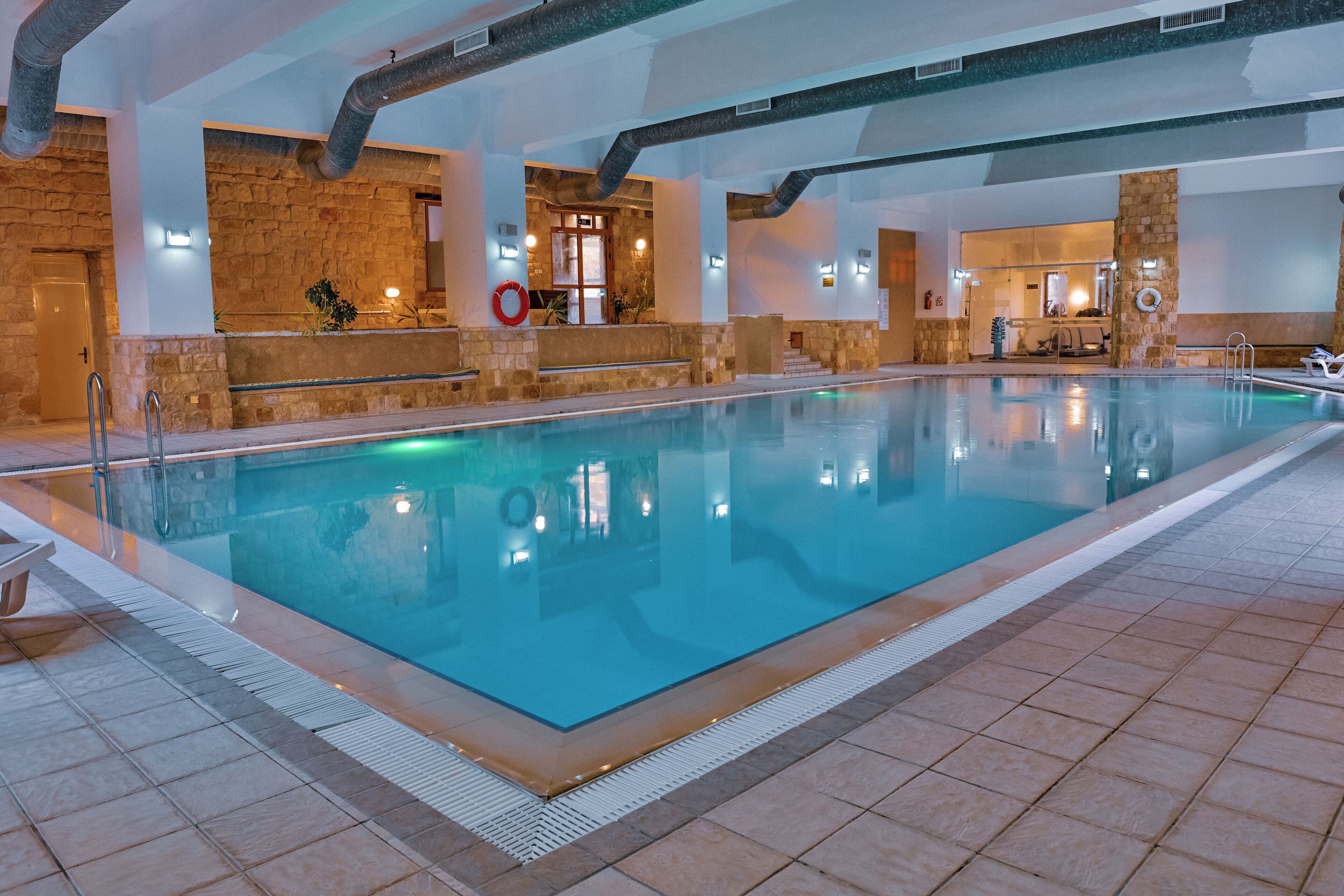Indoor pool, seasonal outdoor pool, open 6 AM to 9:00 PM, pool umbrellas