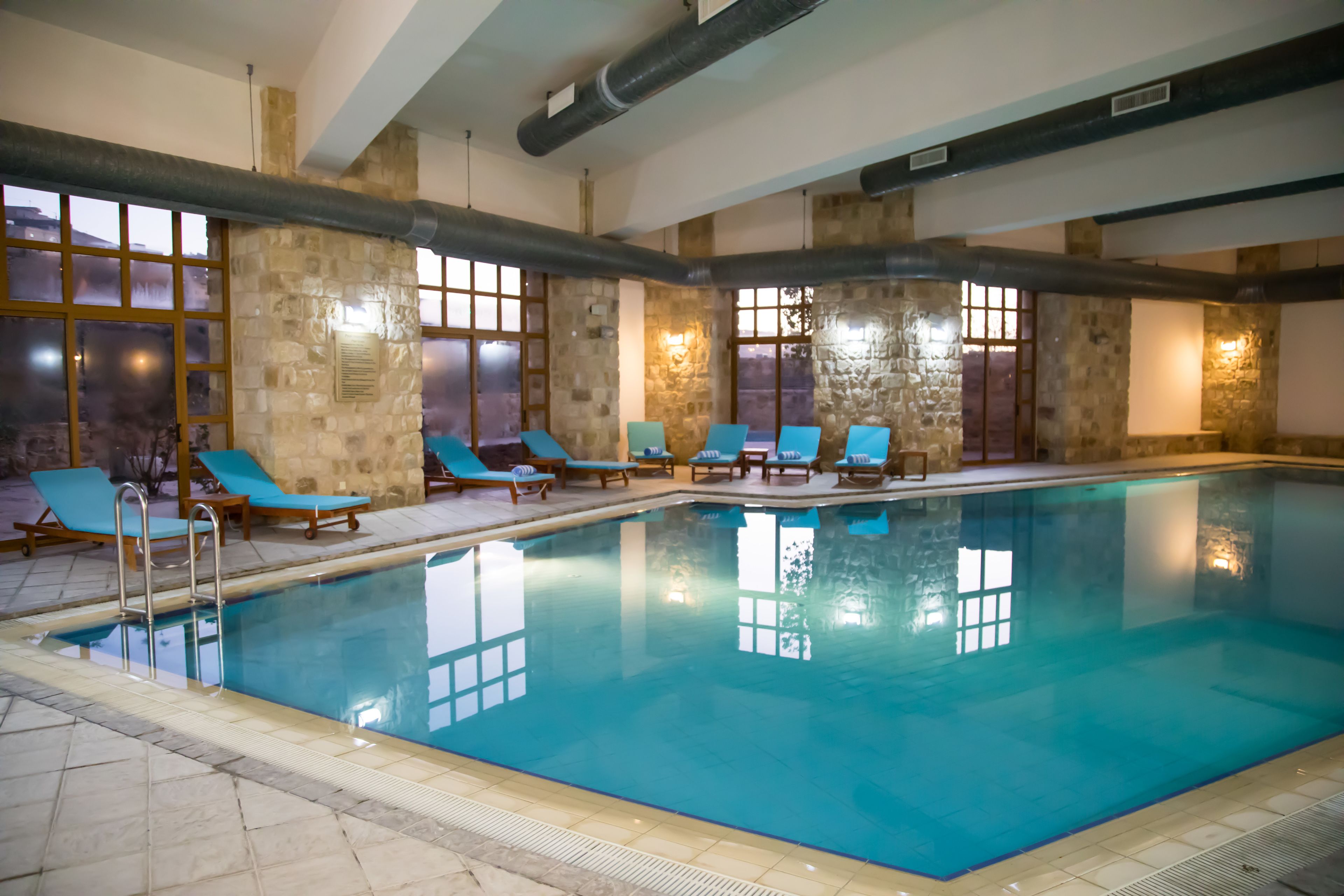 indoor pool, seasonal outdoor pool, open 6 am to 9:00 pm, pool umbrellas