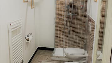 Family Triple Room, Multiple Beds | Bathroom | Shower, free toiletries, hair dryer, bathrobes