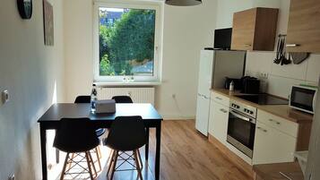 Basic Apartment, 2 Bedrooms | Private kitchen | Fridge, microwave, stovetop, dishwasher