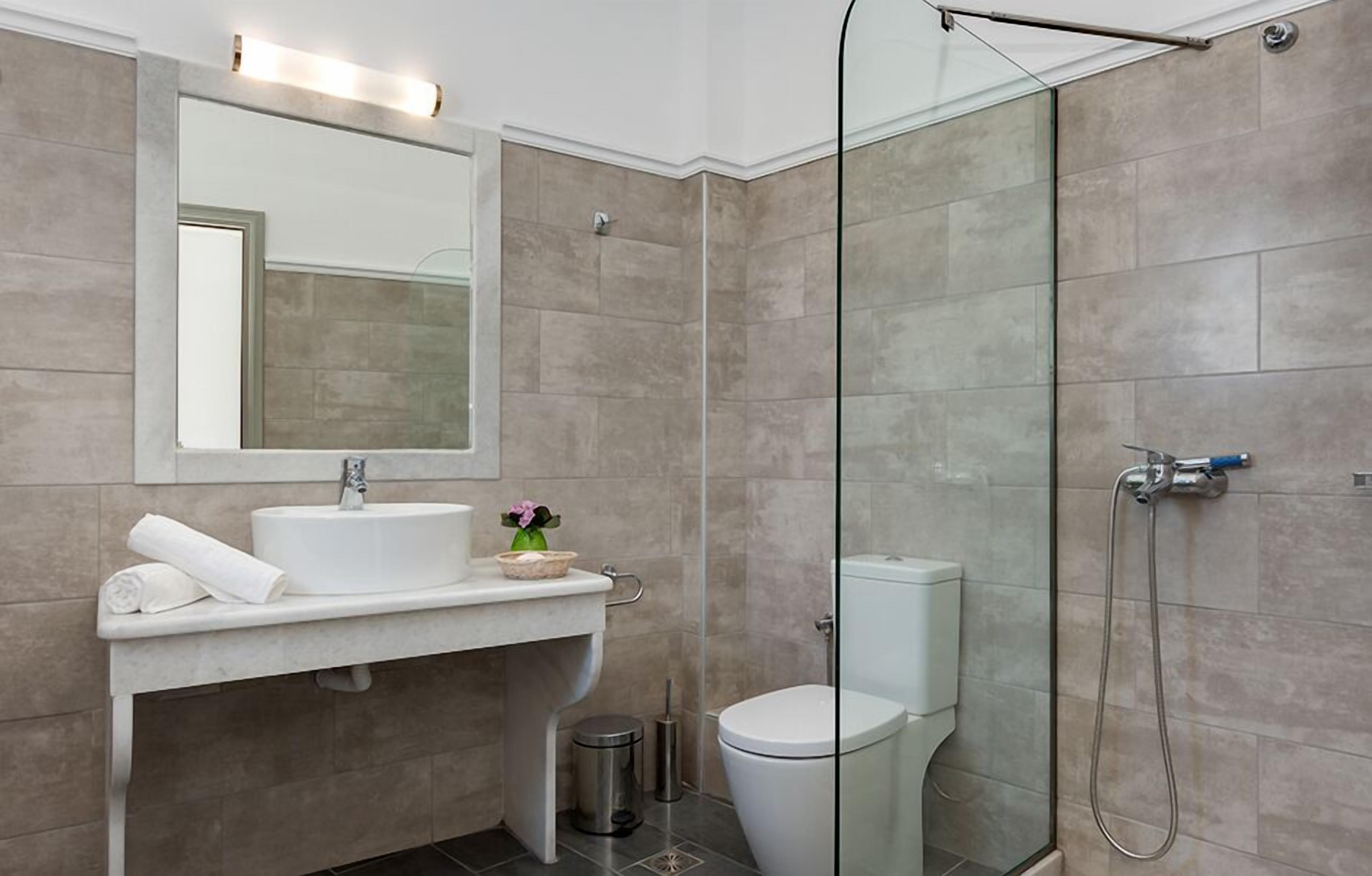 shower, designer toiletries, hair dryer, towels