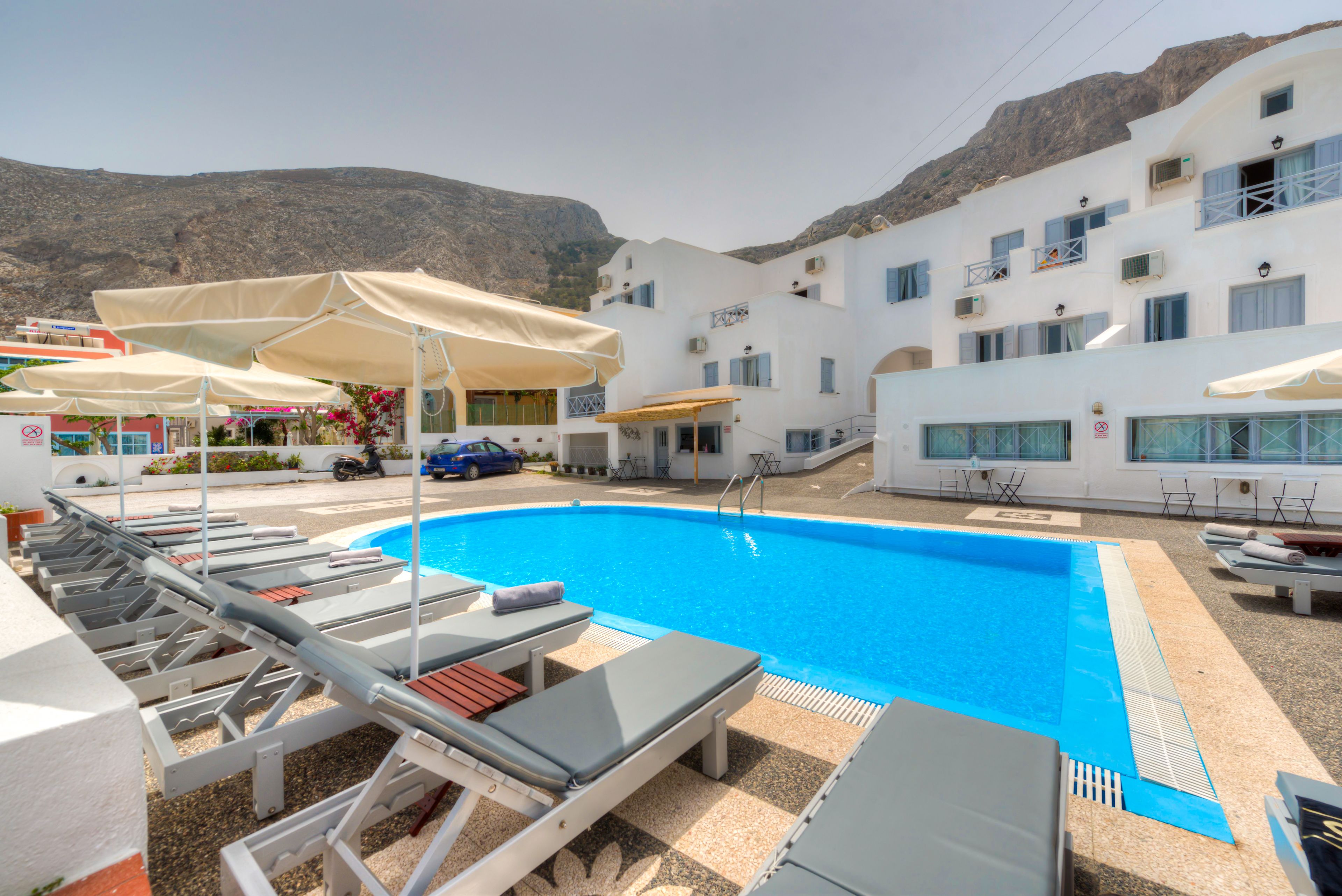 outdoor pool, pool umbrellas, pool loungers