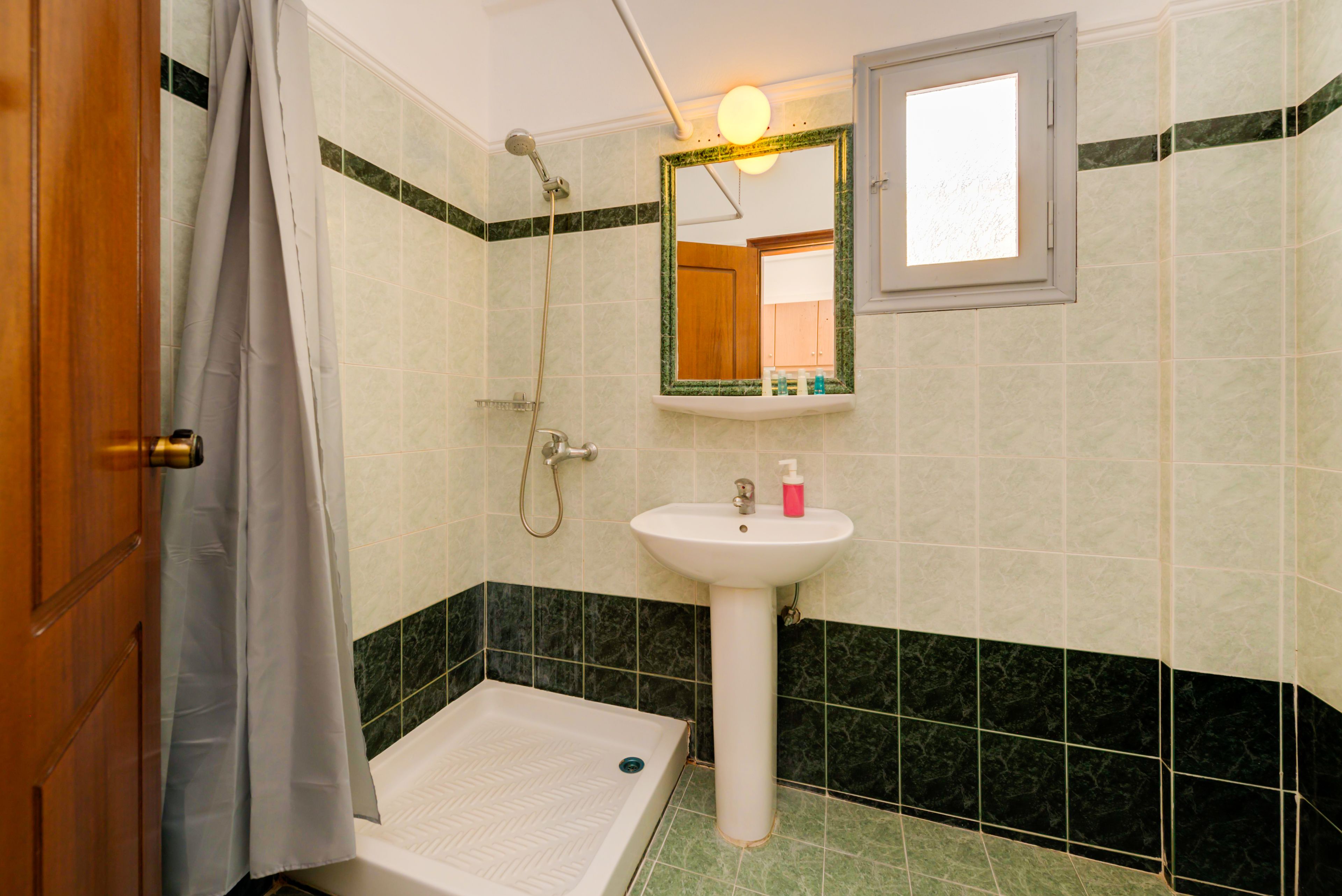 shower, designer toiletries, hair dryer, towels