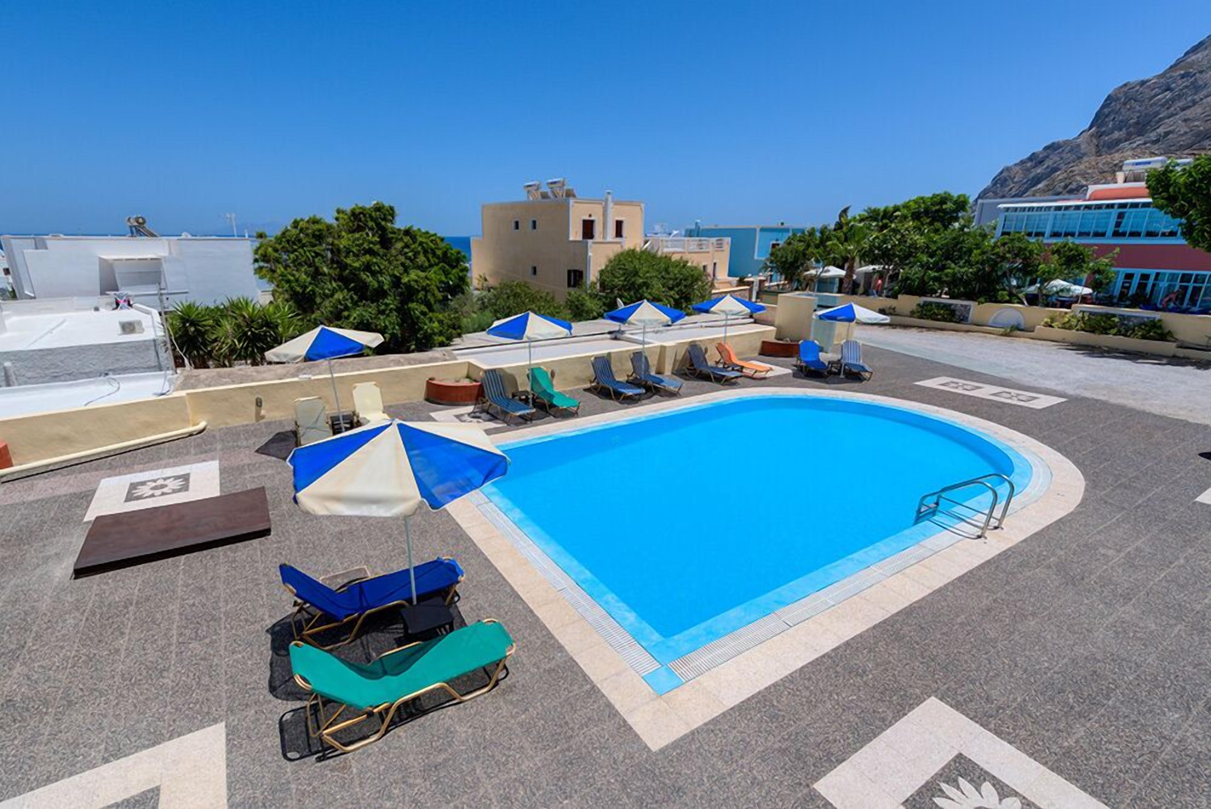 outdoor pool, pool umbrellas, pool loungers