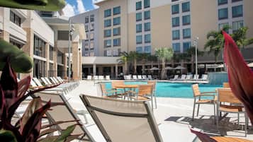 Outdoor pool, open 8:00 AM to 11:00 PM, pool umbrellas, pool loungers