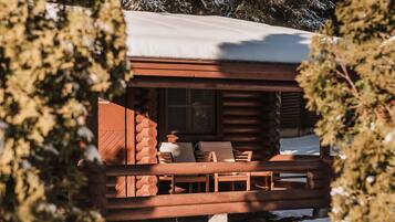 Enjoy outdoor dining or relaxation on the deck with a table and chairs.