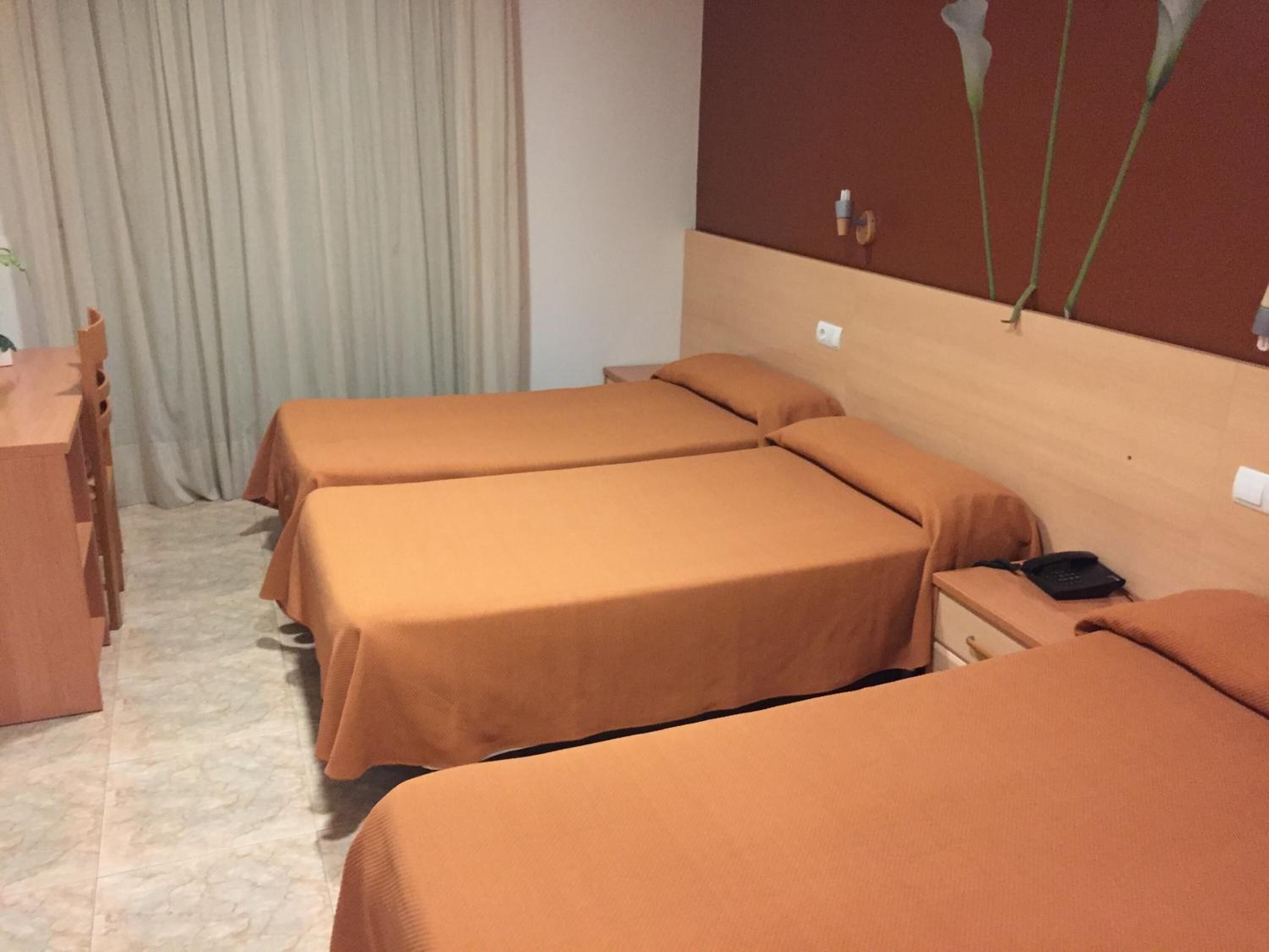 desk, blackout curtains, free wifi, bed sheets