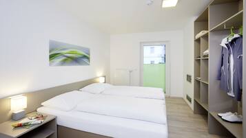 Premium bedding, desk, laptop workspace, free WiFi