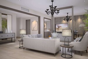 A modern living room with a sofa, two side tables, a chandelier, and a television.