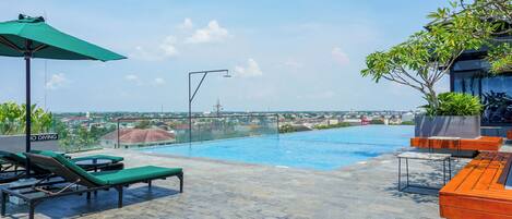 Outdoor pool, pool umbrellas, sun loungers